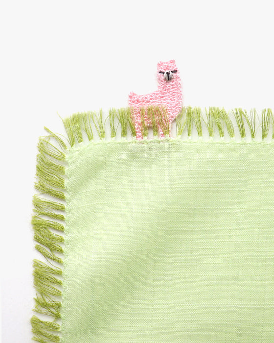 Green fringed handkerchief with pink alpaca design by Kiriko Made