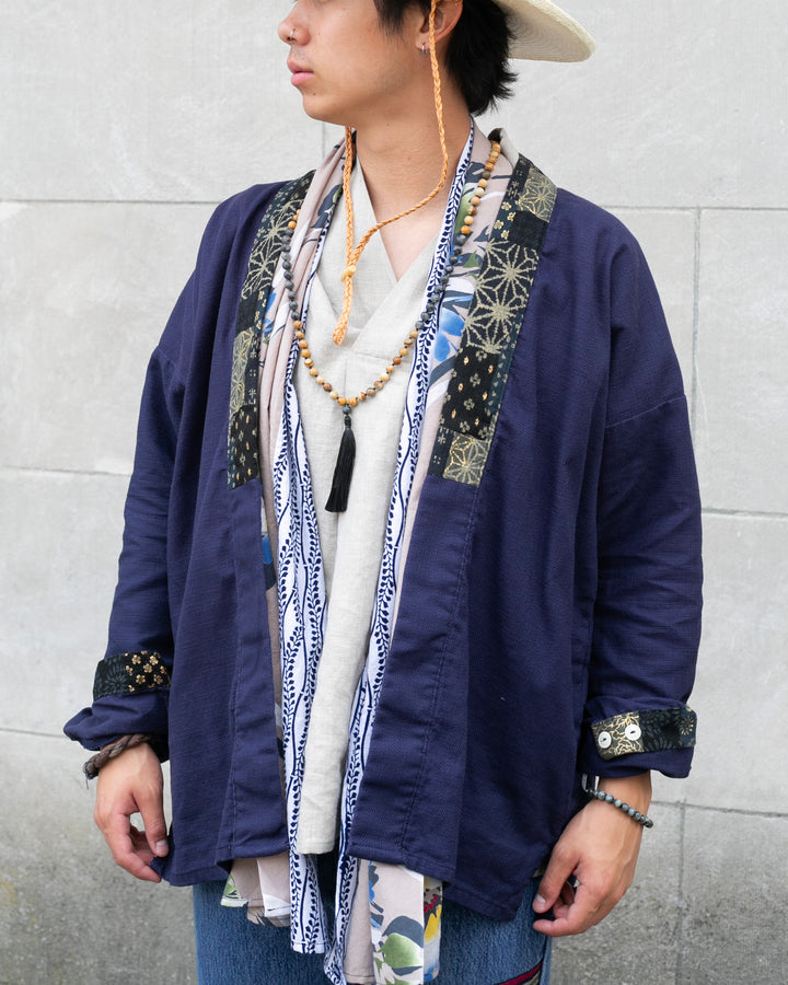 Dark teal and gold noragi jacket with indigo patchwork by Kiriko Made