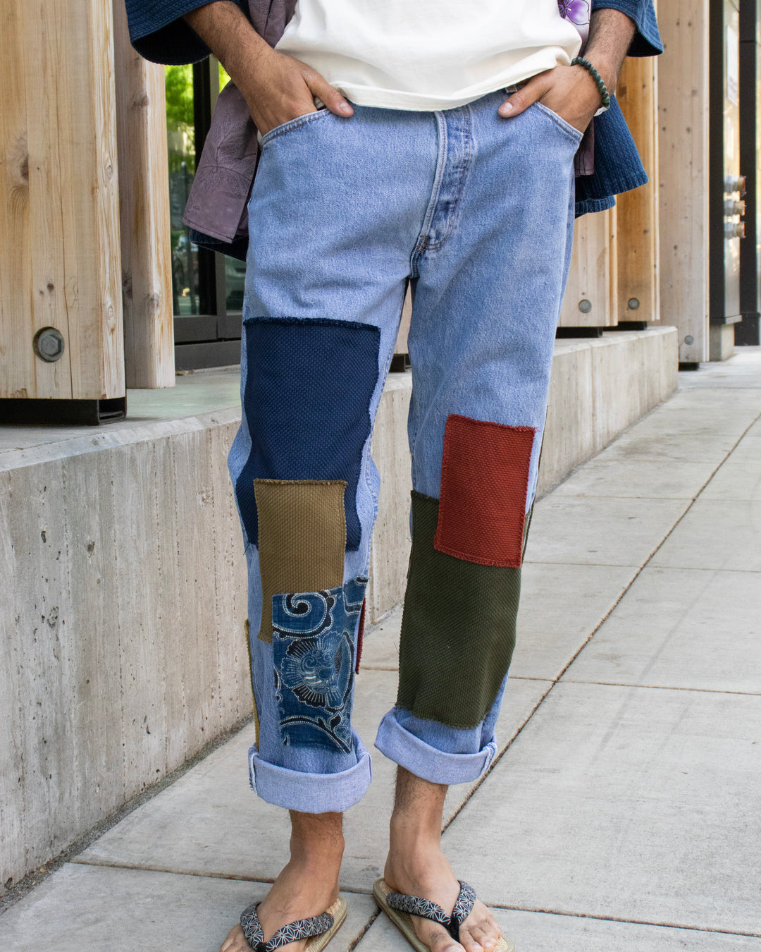 Custom patched denim jeans by Kiriko Made