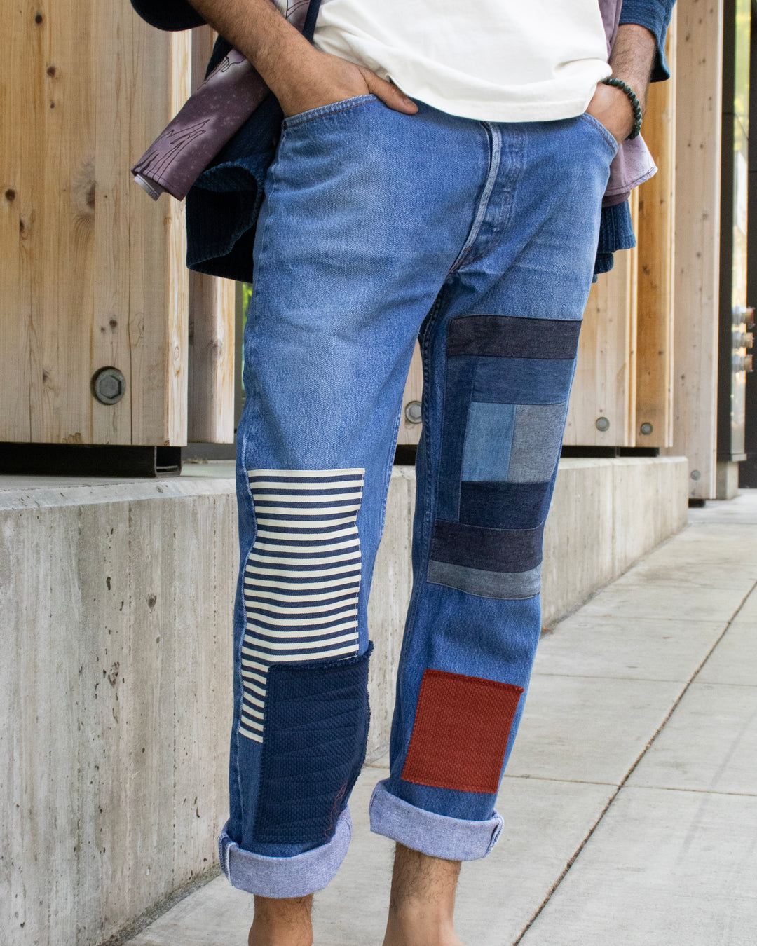 Custom patched denim jeans by Kiriko Made