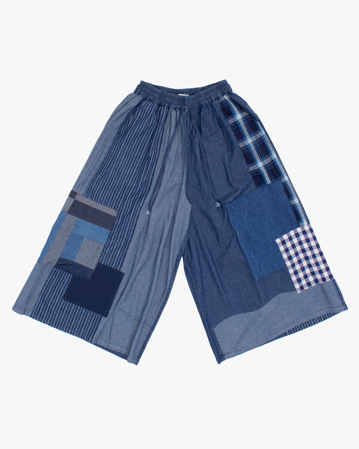 Washed indigo wide leg pants with patchwork by Kiriko Made