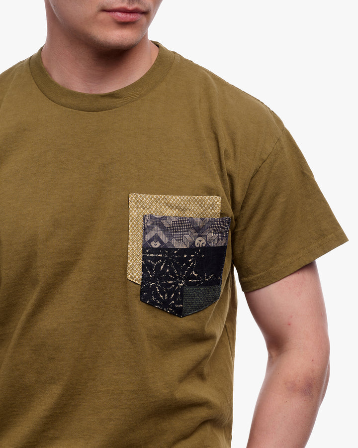 Green tee with yellow shibori and indigo patchwork by Kiriko Made
